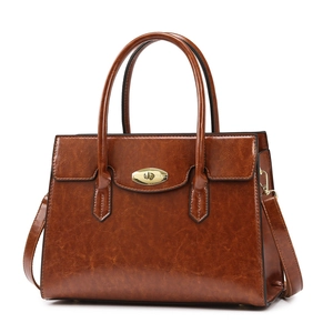 Classic dark brown vintage oil wax leather handbag with gold twist lock and top handles