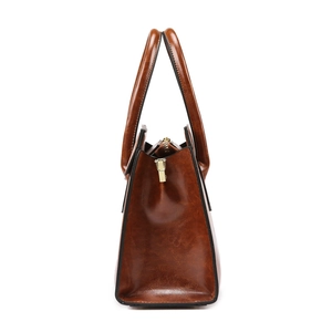 Classic brown faux leather tote bag with glossy finish and secure zipper closure