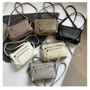 Detail of multi-pocket crossbody bags in six colors with high-quality litchi texture finish