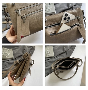 Detail of multi-pocket khaki crossbody bag with litchi texture and metal zippers
