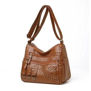 Brown faux leather crossbody bag with woven details and multiple zipper pockets