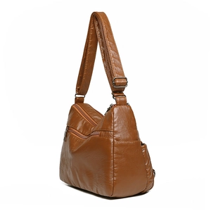 Brown woven PU leather crossbody bag with multiple zipper pockets and soft texture
