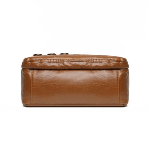Brown woven leather shoulder bag with spacious multi-layer design and soft texture finish