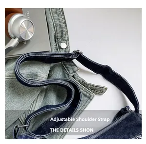 Detail view of the adjustable denim shoulder strap with high-quality metal buckles