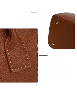 Dettaglio borsa in pelle caramello con cuciture bianche e borchie metalliche dorate