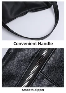 Detail of black lychee grain leather tote bag with smooth metal zipper and durable handles