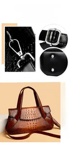 Detailed view of silver-tone metal hardware and crocodile texture on brown handbag