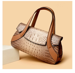 Close-up of brown crocodile embossed texture and gradient finish on large tote bag