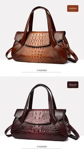 Detail view of red and yellow crocodile pattern handbags with top handles and straps