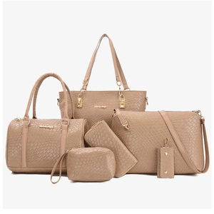 Detail of khaki 6-piece tote bag set featuring woven textured PU leather and gold hardware