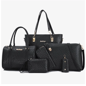 Detail of a 6-piece black PU leather tote bag set with elegant woven texture and gold hardware
