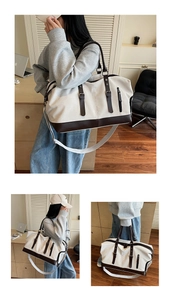 Close-up of canvas travel bag with brown leather details and adjustable shoulder strap
