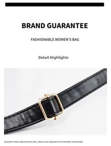 Detail of adjustable shoulder strap with gold metal buckle on black PU leather tote bag