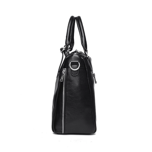 Side view of a black pebbled leather handbag for women with silver zipper details