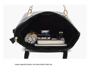 Detail view of large capacity black PU tote bag showing organized interior storage space