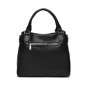 Minimalist black pebble leather tote bag with silver zipper pocket and sturdy top handle