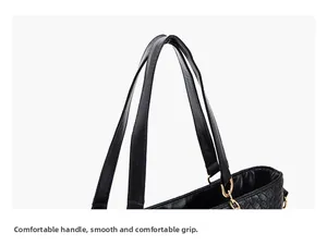 Close-up of the durable black woven PU leather handle and metal buckle on the tote bag