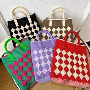 Mini knitted crossbody phone bags in five vibrant colors with geometric pattern textures