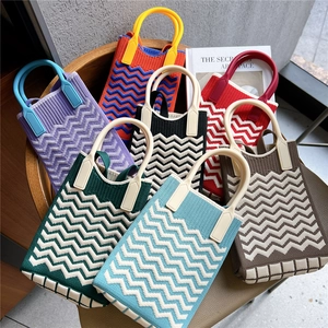 Mini knit phone crossbody bag with wavy pattern and round handles in various colors