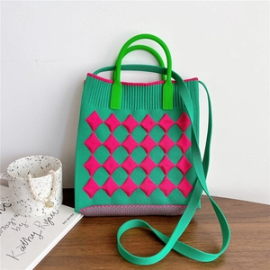 Detail of green and pink checkered knit tote bag with round handle and woven shoulder strap