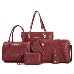 Deep red 6-piece tote bag set with embossed woven pattern and gold metal logo