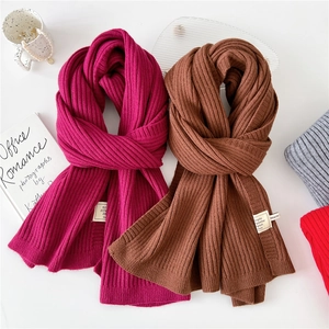 Thick solid color knit scarf in rose and brown with soft ribbed texture for winter