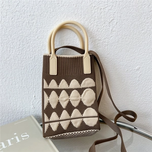 Detailed knit cross-body phone bag with beige geometric patterns and rigid handles