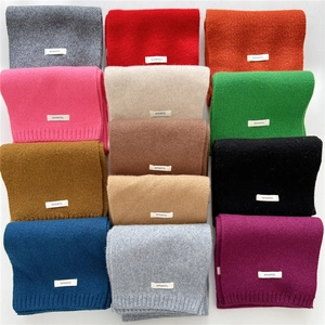 Solid color 100% wool knitted scarves displayed in twelve vibrant colors in a neat layout