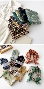 Detail of assorted printed cotton linen scarves featuring vintage floral and plaid patterns