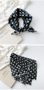 Detail view of cotton linen scarf tied on neck with retro geometric square patterns