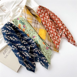 Set of four cotton linen floral square scarves in vintage prints on white shirt background