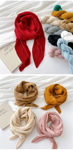Detailed view of colorful accordion pleated skinny scarves in various vibrant solid colors