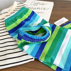 Close-up of soft colorful striped waffle knit lounge sleeves and textured fabric detail