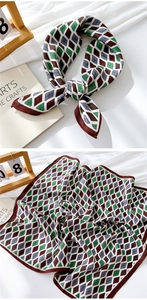 Detail of soft geometric linen scarf with brown rolled edges and artistic aesthetic