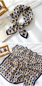 Detail of soft geometric diamond pattern cotton linen scarf with elegant knot styling