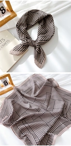Close-up of geometric striped cotton linen scarf showing soft texture and fine stitching