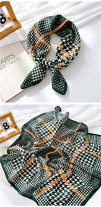 Close-up of green houndstooth cotton linen scarf with Fashion Modern text detail