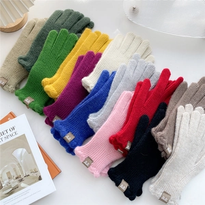 Solid knit touch screen gloves in various colors with a stylish leather brand tag