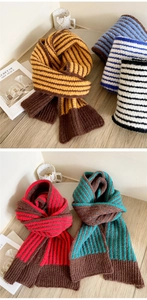 Close-up of thick striped knit texture and ribbed ends of winter thermal scarves