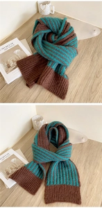 Macro detail of the brown and teal striped knit scarf showing premium ribbed edge texture