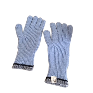 Light blue knitted touchscreen gloves for winter with grey ribbed cuffs and brand label