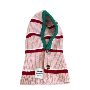 Pink striped knit balaclava hat with green trim and button closure for winter warmth