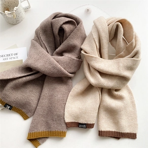 Thick two-tone knitted scarf in coffee and beige with ribbed edges and brand label