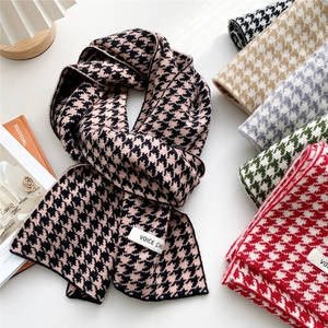 Classic houndstooth knitted scarf in multiple colors with minimalist logo patch
