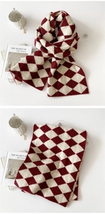 Detail of red and white diamond knit scarf showing soft texture and pattern