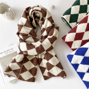 Classic diamond pattern knit scarf in warm khaki and beige tones for winter warmth