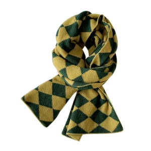 Knitted winter scarf with green and yellow diamond pattern on a white background