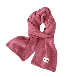 Pink knit scarf for women featuring a minimalist Dream Freedom label on soft fabric