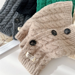 Knitted buttoned neck warmer with cable stitch pattern in various autumn colors