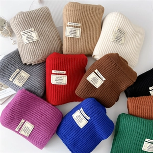 Solid color knit scarves in multiple colors made of acrylic nylon and PBT blend